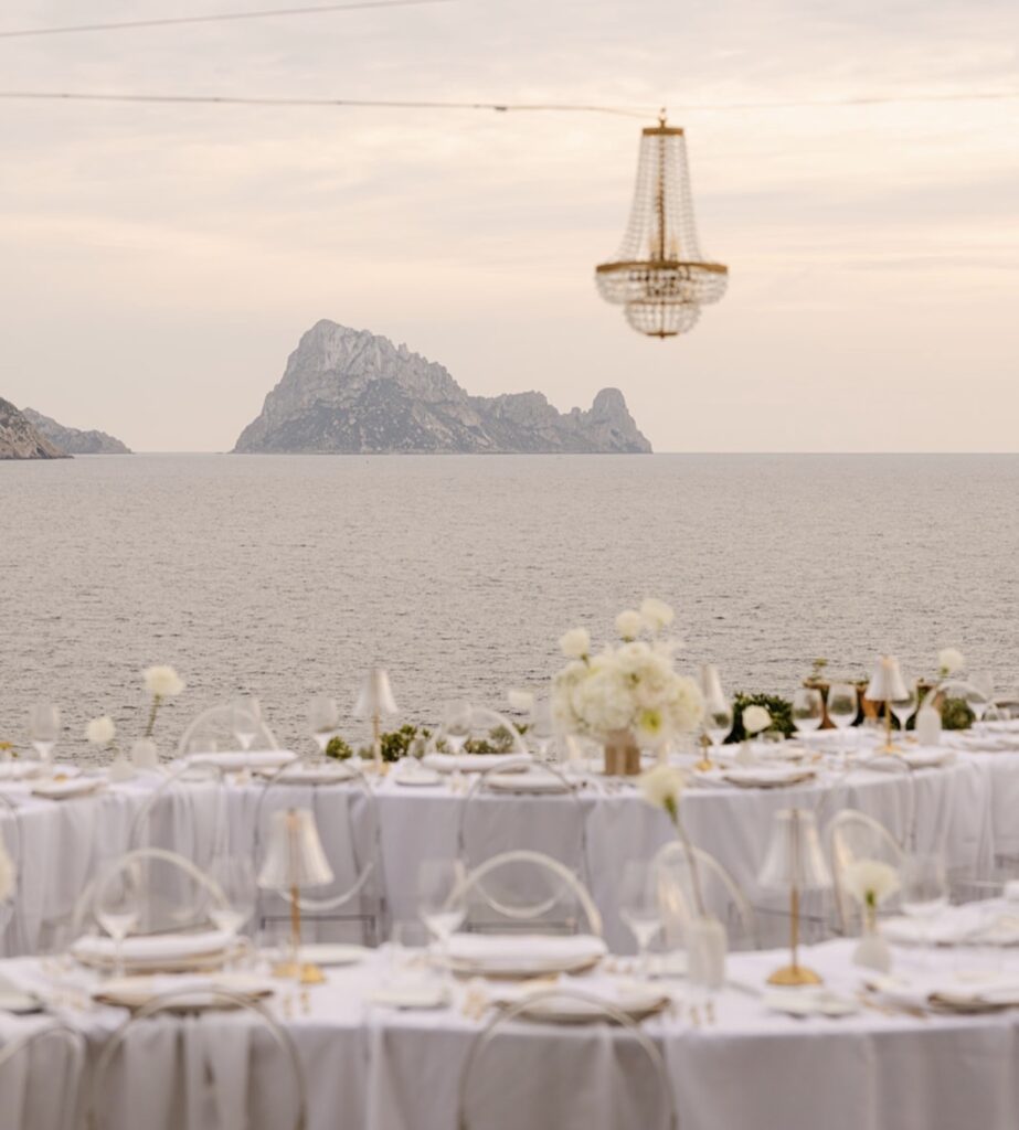 Wedding tables, set up for a luxurious wedding at the destination with views of the sea and the island of Es Vedra.